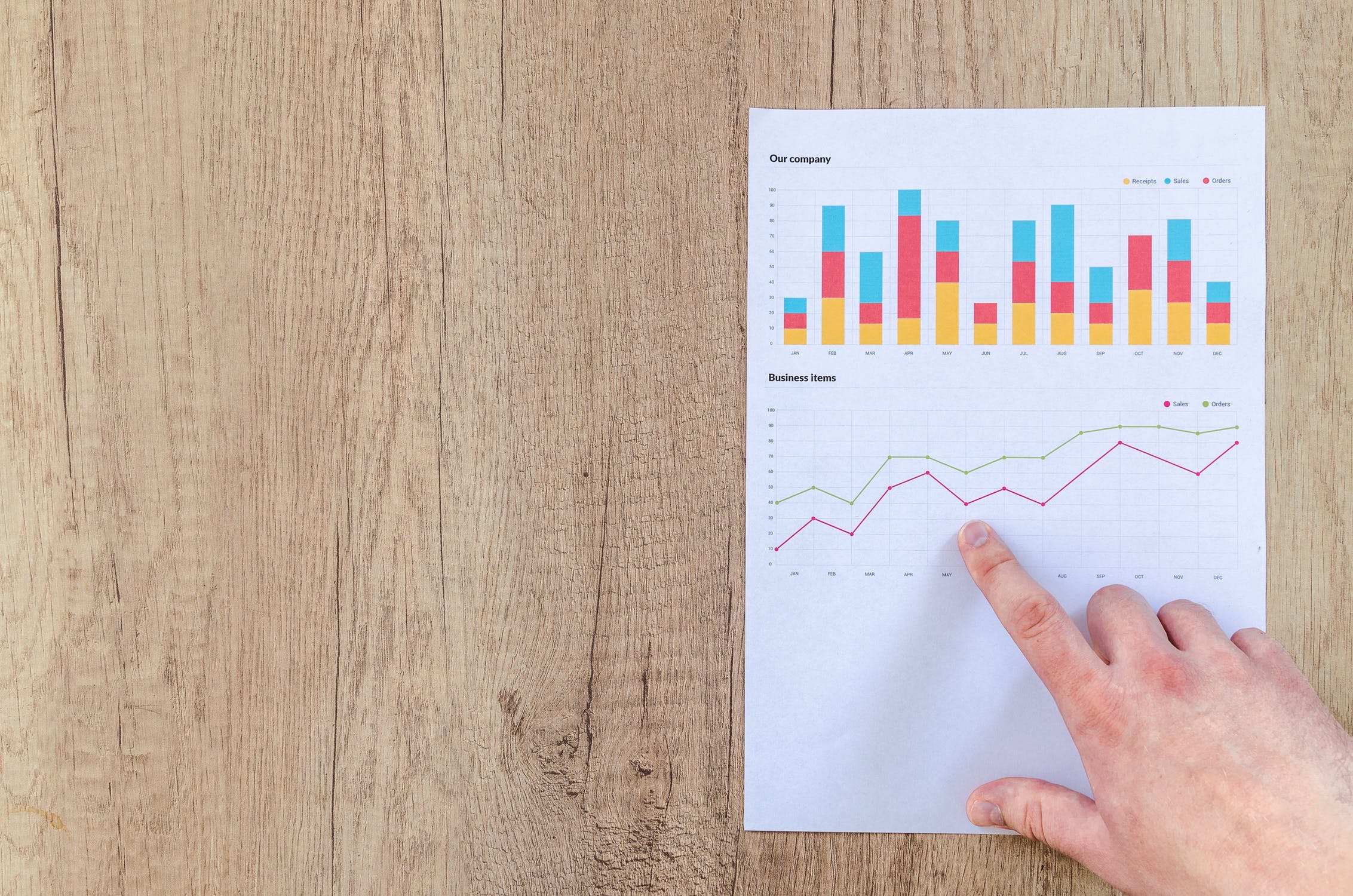 person-pointing-at-data-charts