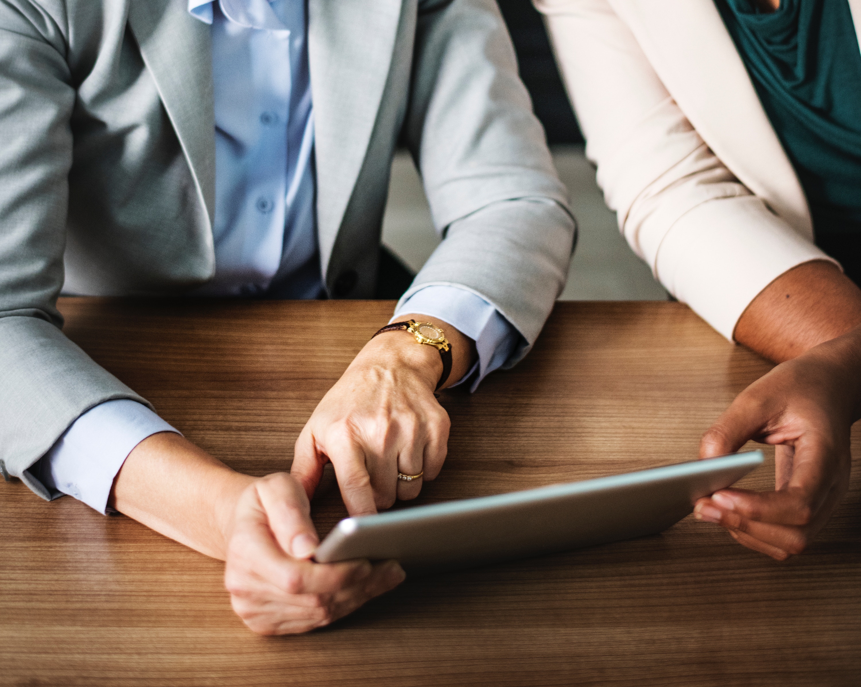 two-people-looking-at-ipad